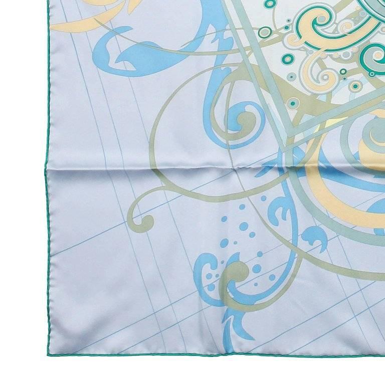 This authentic Hermes H Comme Histoires 90 cm Silk Scarf is new and unworn. Designed by artist Dimitri Rybaltchenko and issued 2010. Just like the cover page in a story this design features a swirly and fanciful H on a powder blue background. Made