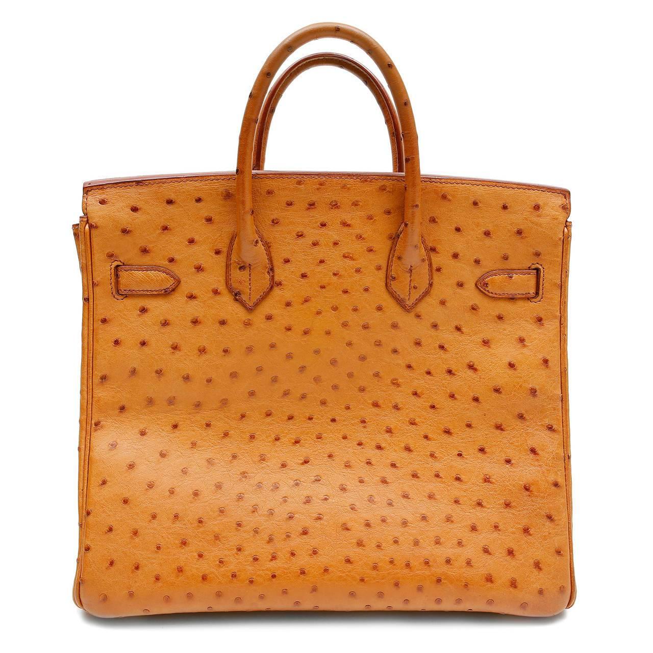 Hermes Miel Ostrich 32 cm Haut a Courroies- HAC Birkin Bag Pristine condition Considered the ultimate luxury item the world over and hand stitched by skilled craftsmen, wait lists of a year or more are commonplace for Hermes bags. This particular