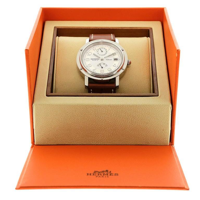 Hermès Chronograph Watch- PRISTINE Unisex style. Stainless steel, automatic, brown leather adjustable band. N stamp.   
Hermès. Box included.