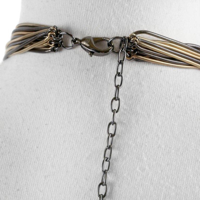Chanel Snake Chain Belt Necklace- Pristine. A stunning multi chained statement piece that is very versatile thanks to the variable length and combination of metals. Dark gold and black snake chains are bundled together and clasp with a gunmetal