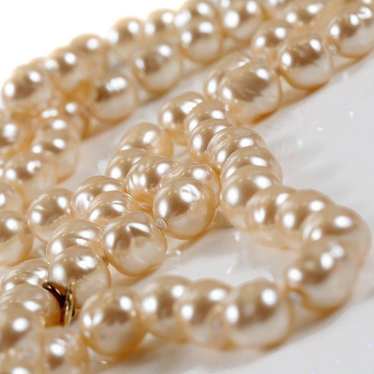 Chanel Champagne Baroque Pearl Necklace-Mint Vintage Condition. From 1981, this piece has proven to be a timeless collectible. Large baroque long pearl strand in dreamy champagne color.  18 inches, 36 inches end to end. 
A209