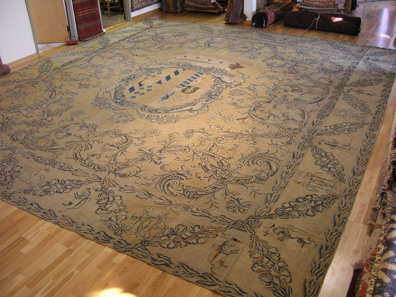 Rare wedding commemorative weaving depicting the marriage and joining of two European royal families. The crown atop the center medallion denotes the royalty. The size and design elements clearly indicate that this was commission to be woven as a