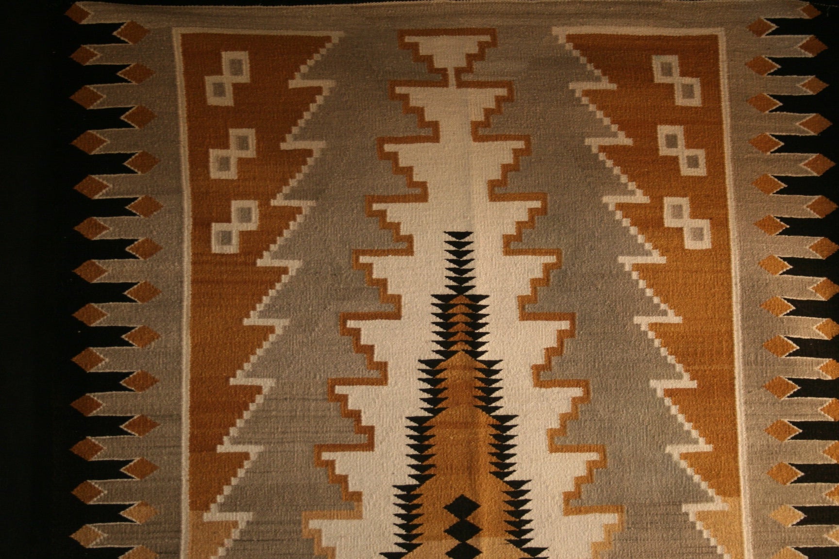 This is a very visual Vintage Navajo weaving from the Klagetoh trading post. This piece is rather oversized in dimensions, indicating it was a special order weaving.  The blend of natural and plant dyes is soothing and pleasant, reflecting the