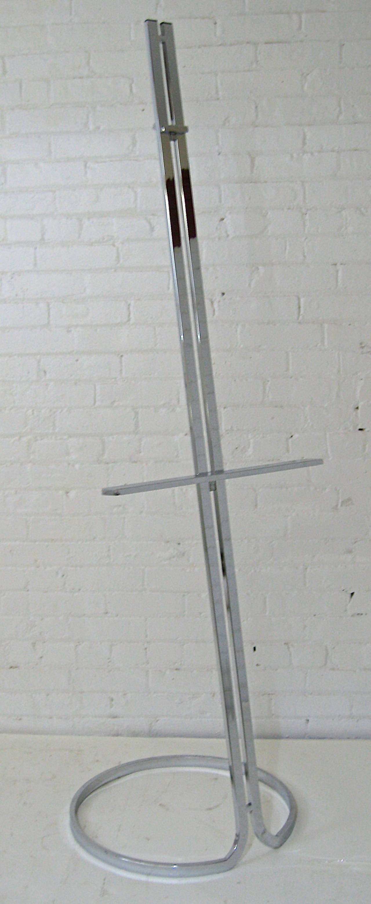 Very sexy circa 1970s adjustable chrome easel attributed often to Milo Baughman. Excellent condition with some very minor scratches. Base measures 20
