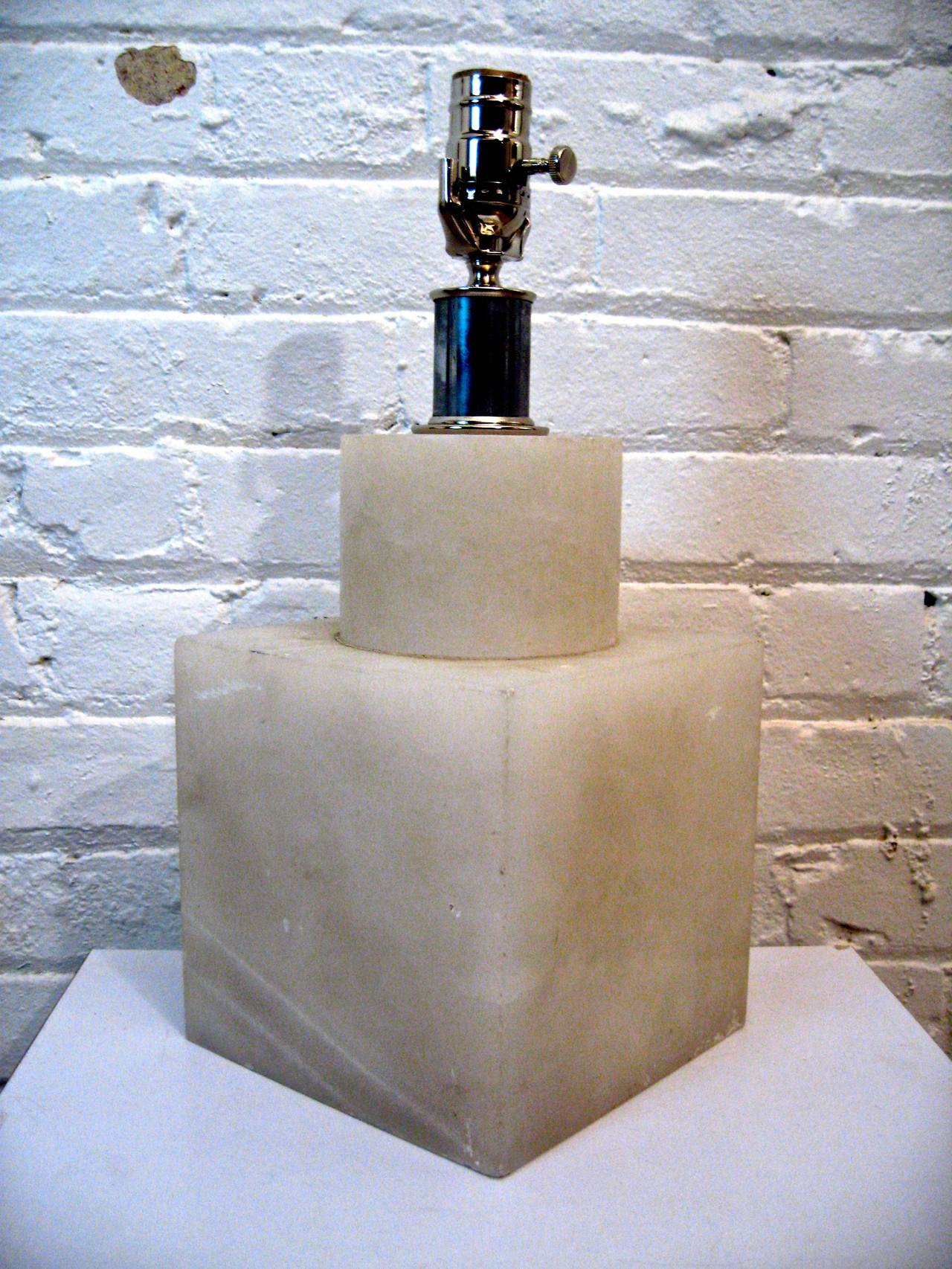 Simply geometric, the cube and the cylinder.  The interior lights up too.  Translucent alabaster and newly re-wired.  Signed on the back, SG, Base Made in Italy.  Overall height from base to top of socket is 16