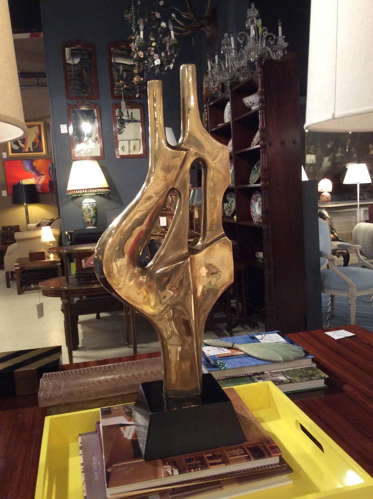 Graphic and large-scaled aged brass abstract sculpture on black lacquered base, in the style of American sculptor, Dorothy Dehner (1901-1994). Published piece in October 2012, Elle Decor, Ivanka Trump's Living Room on Park Avenue.