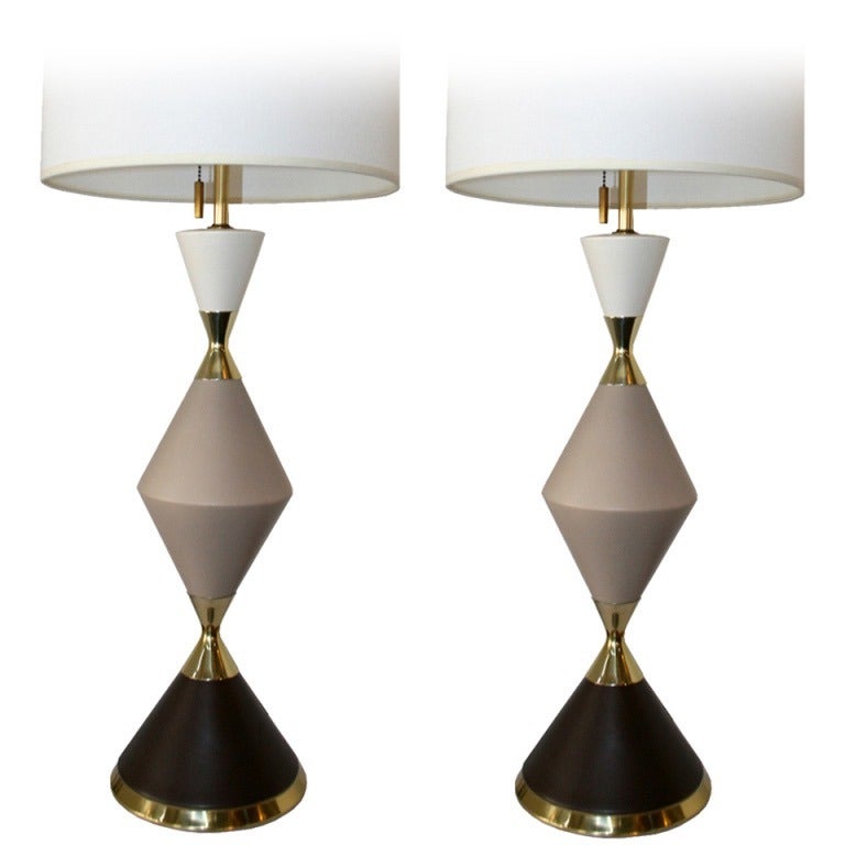 Sold as a Single or Pair, Rare tri-colored table lamp of interlocking hourglass shapes in porcelain with polished brass fittings by Gerald Thurston for Lightolier. American, circa 1950. Priced per item.