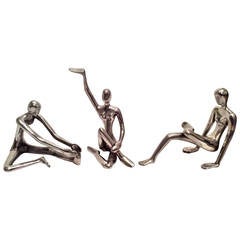 Trio of Modernist Polished Steel Figurative Sculptures, in Yoga Poses