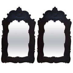 Impressive Pair of Ebonized Carved Wood Mirrors