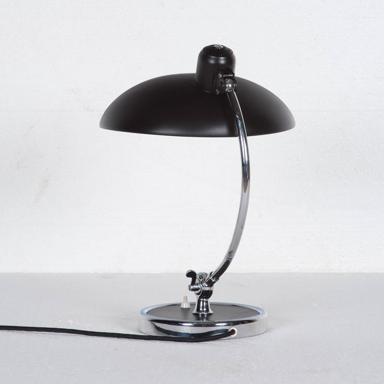 Mid-Century Kaiser Idell model 6631-LUXUS President desk lamp designed by Christian Dell for Kaiser Idell in 1936.  This is an original Bauhaus design and is regarded as one of Christian Dell’s masterpieces. Stunning matte black lampshade and a