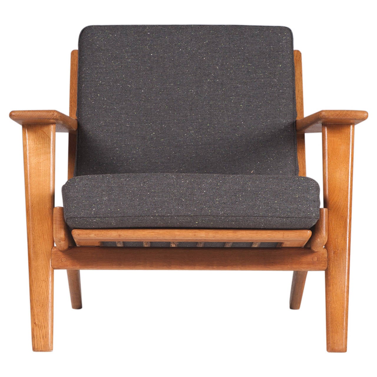 Plank Armchair by renowned Danish designer Hans J. Wegner in beautifully restored condition. Manufactured by Getama in 1953. Newly upholstered in high quality Instyle fabric with a beautiful sold oak frame. Sold as a pair, please enquire for single