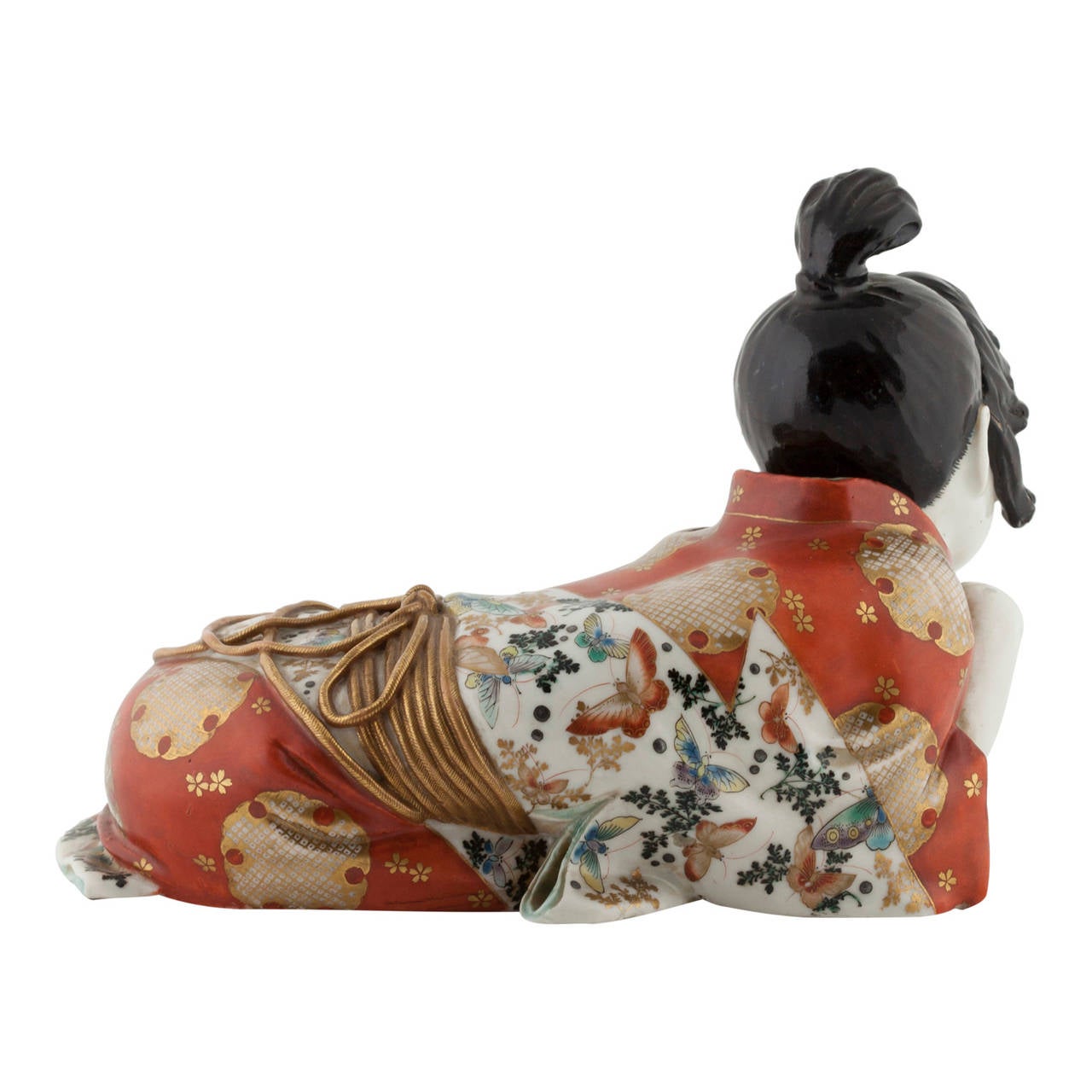 Japanese, Kutani  c1870

Erotic porcelain figure of a resting woman with her head on her hand.  A companion is kitten plays with ball at her side, indicating another side to her character. When the figure is turned over the kimono parts to reveal