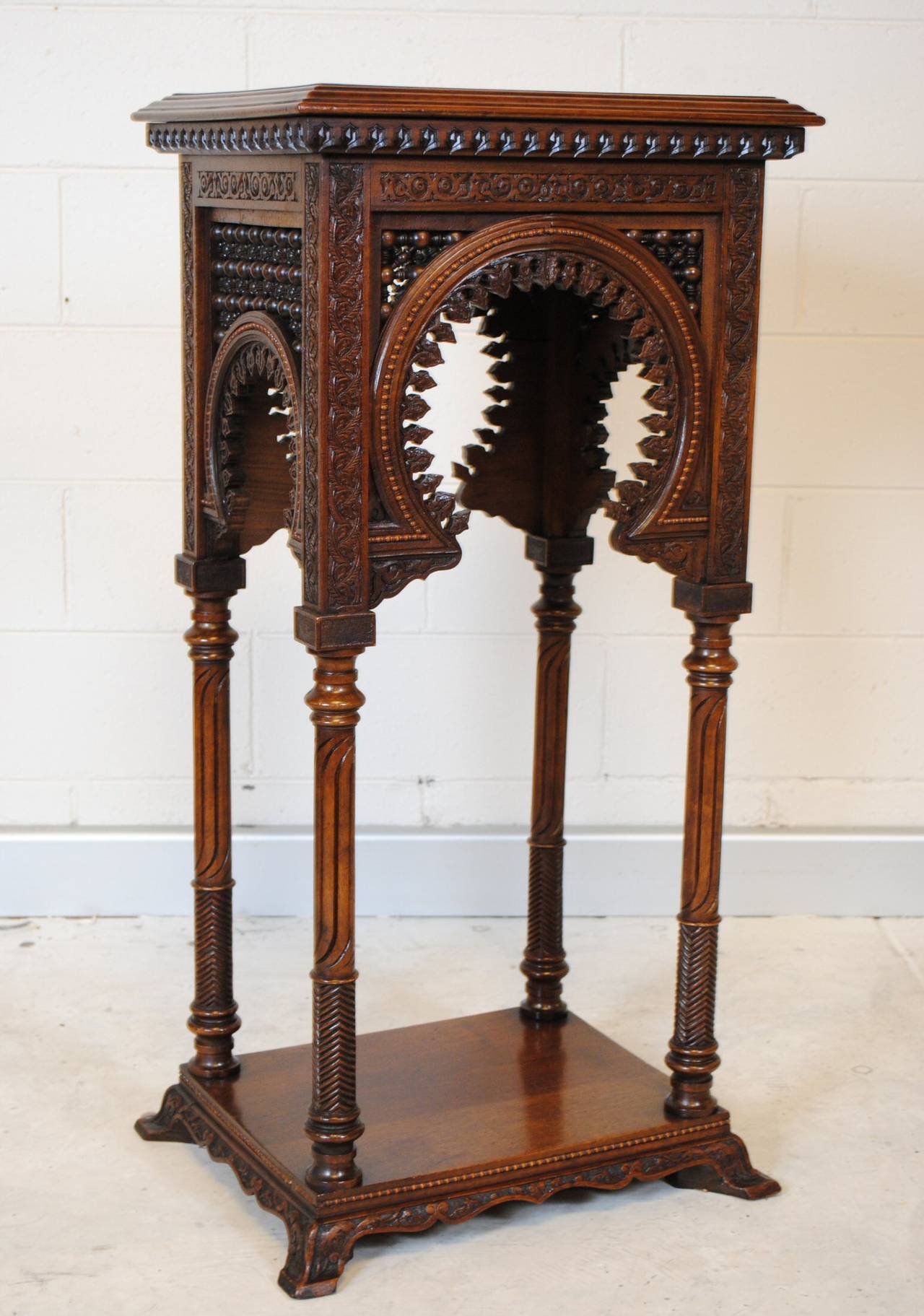 French carved Walnut pedestal in the Moorish taste and dating as circa 1900.
