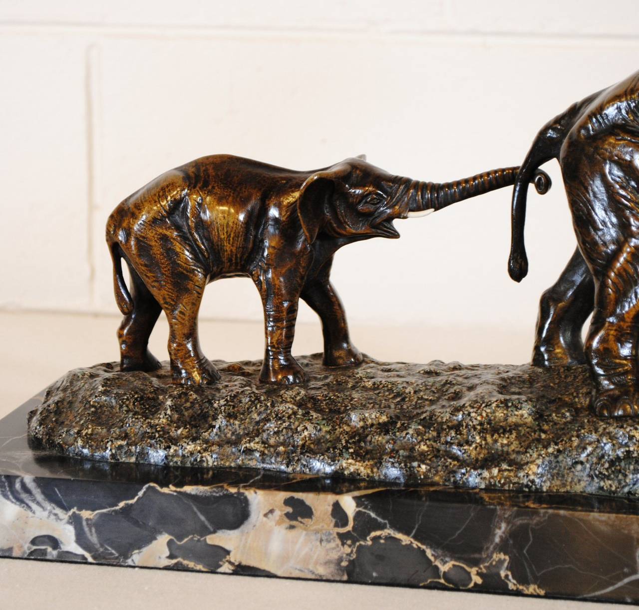 Superb French bronze sculpture of a mother elephant and her calf. The signature of Irénée Rochard impressed into the rocks near the elephants foot. The piece dates from the 1930s.