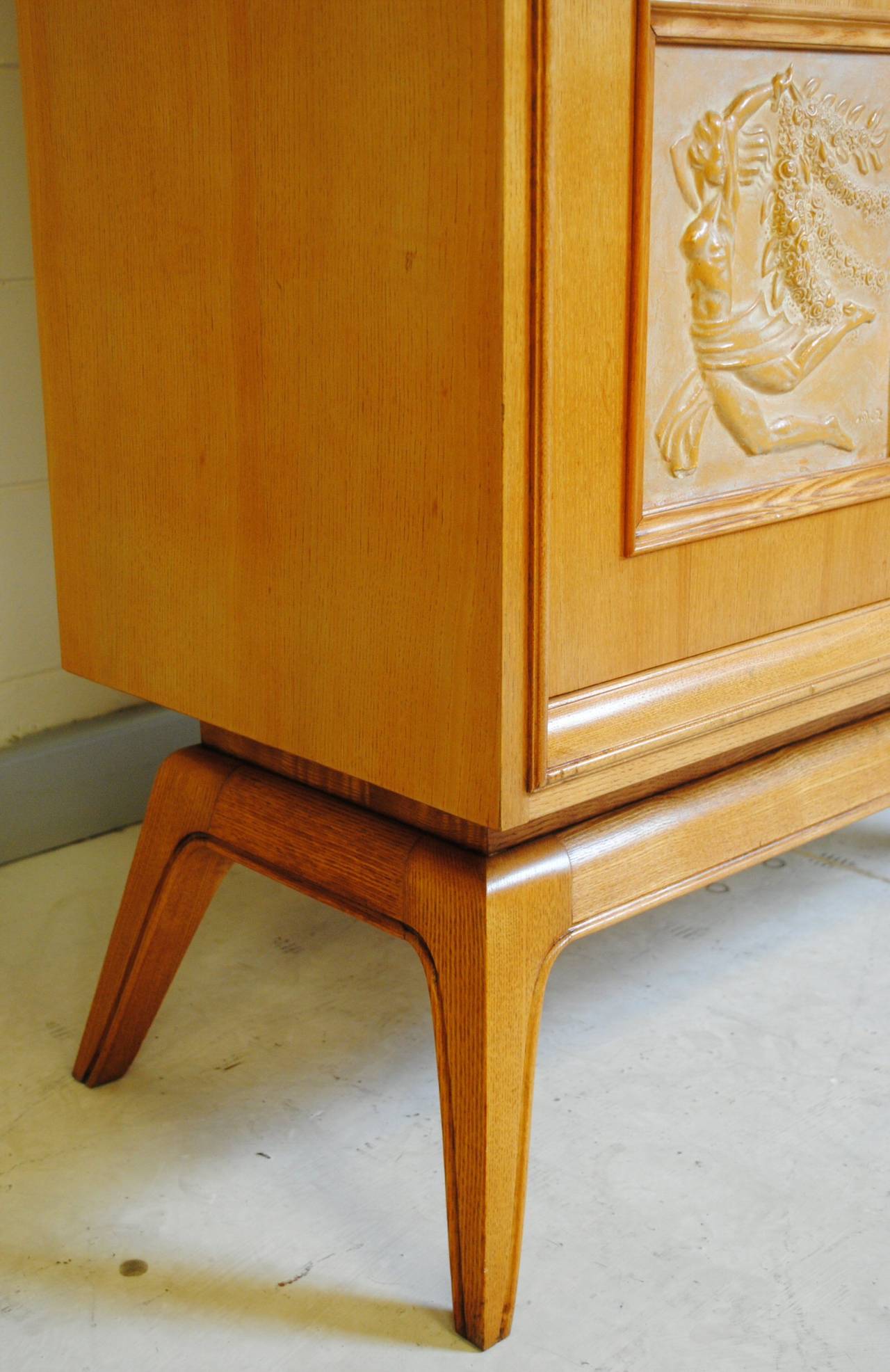 Mid-Century Modern Early 1950s Oak Cabinet with Signed Relief Panels For Sale