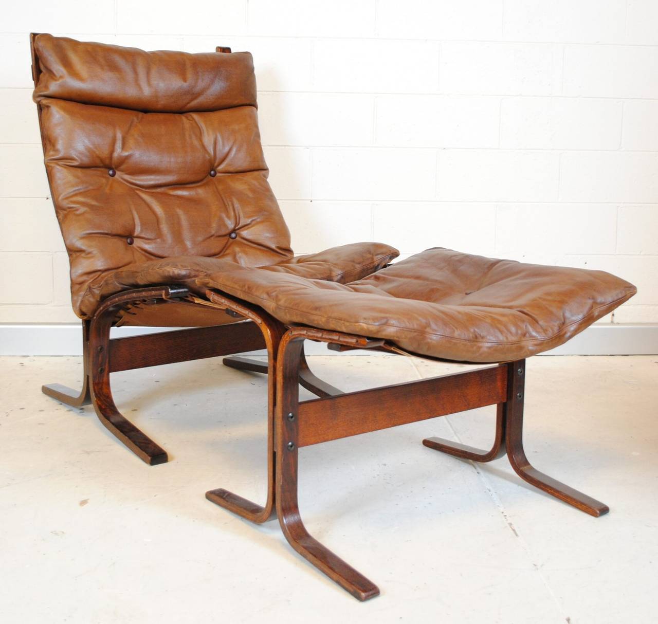 Scandinavian Modern rosewood framed leather siesta chair and matching stool. From Westnofa of Norway, designed by Ingmar Relling, and winner of the 1966 design award in Copenhagen.

For those interested we do have another chair and stool just like