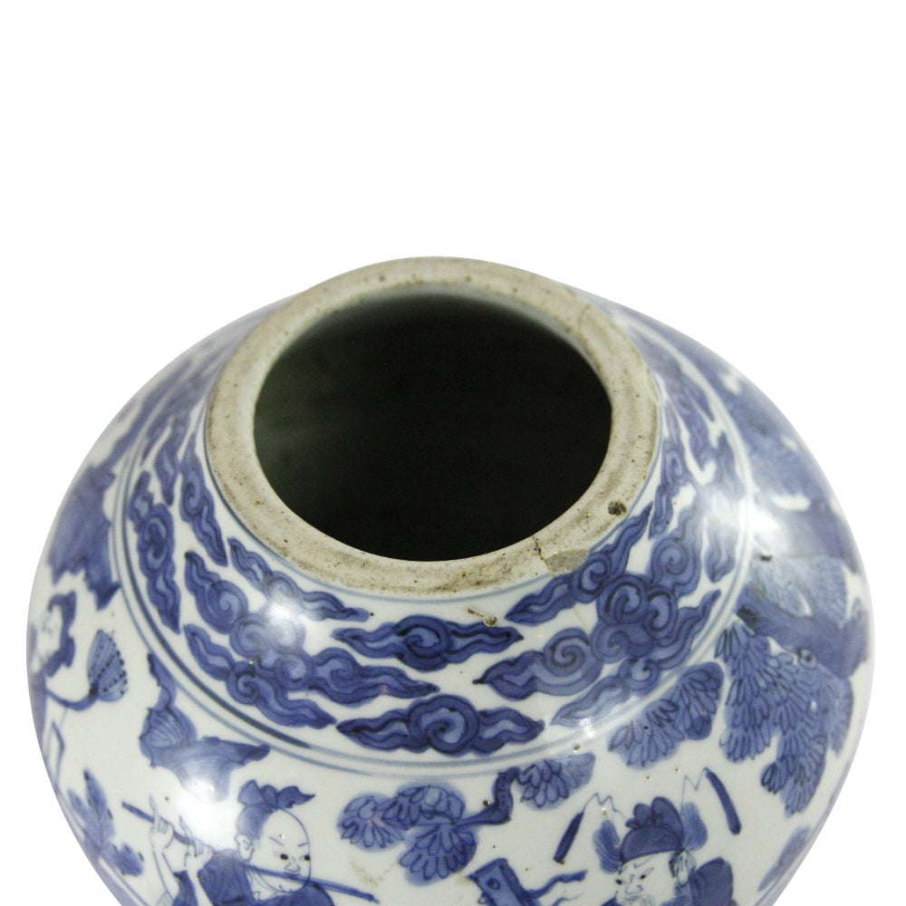 A Ming dynasty white and blue globular vessel, portraying six figures in a fenced garden underneath clouds. The vase was originally a double gourd vase and has been cut down and reduced in size to the vessel it is now.