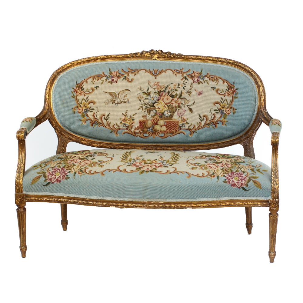 This elegant and highly ornamental French salon suite features a canape and two arm chairs each measuring 62cm wide, 50cm deep and 96cm high. The Aubusson tapestry used to upholster the set feature exotic birds, garlands of roses and baskets of