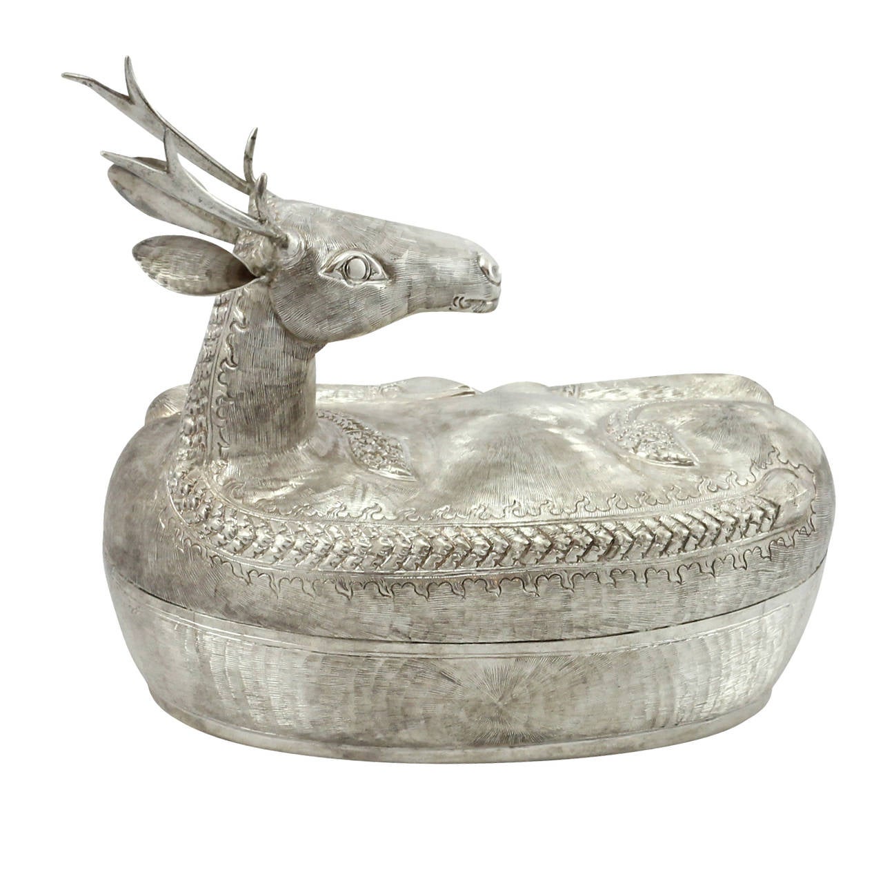 A .900 silver betel nut container in the form of a reclined deer. Handmade with repoussé and chased details. Produced in Cambodia. Stamped S. Khân.