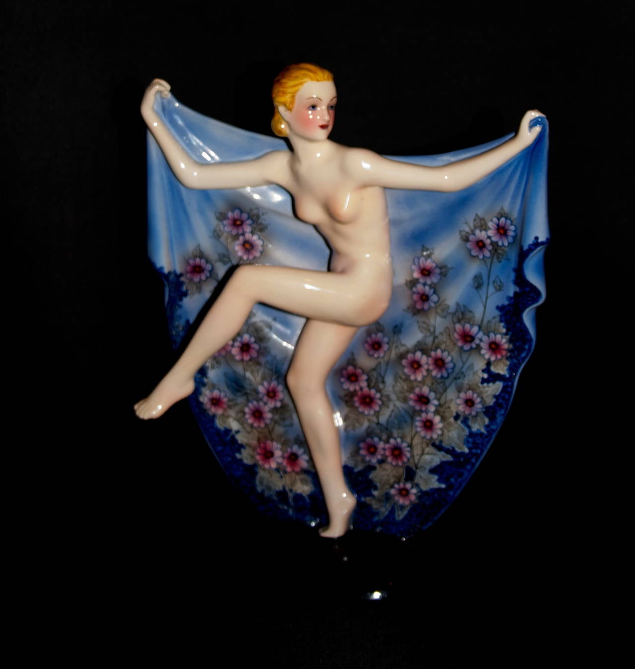 A Beautiful and rare art deco figure by Josef Lorenzl for Keramos ceramics
This is a large figure and features a nude dancer holding open her cape.
Hand painted in a sky blue color and featuring hand raised red flowers.
Josef Lorenz worked for