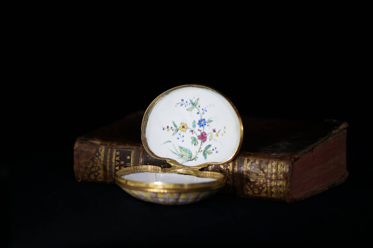 Rare Chinese export snuff box, enamel on copper, of scallop shell form, the one half naturalistically modelled and painted, the other similarly decorated with the addition of several flowering plants, the lid interior with another flowering plant