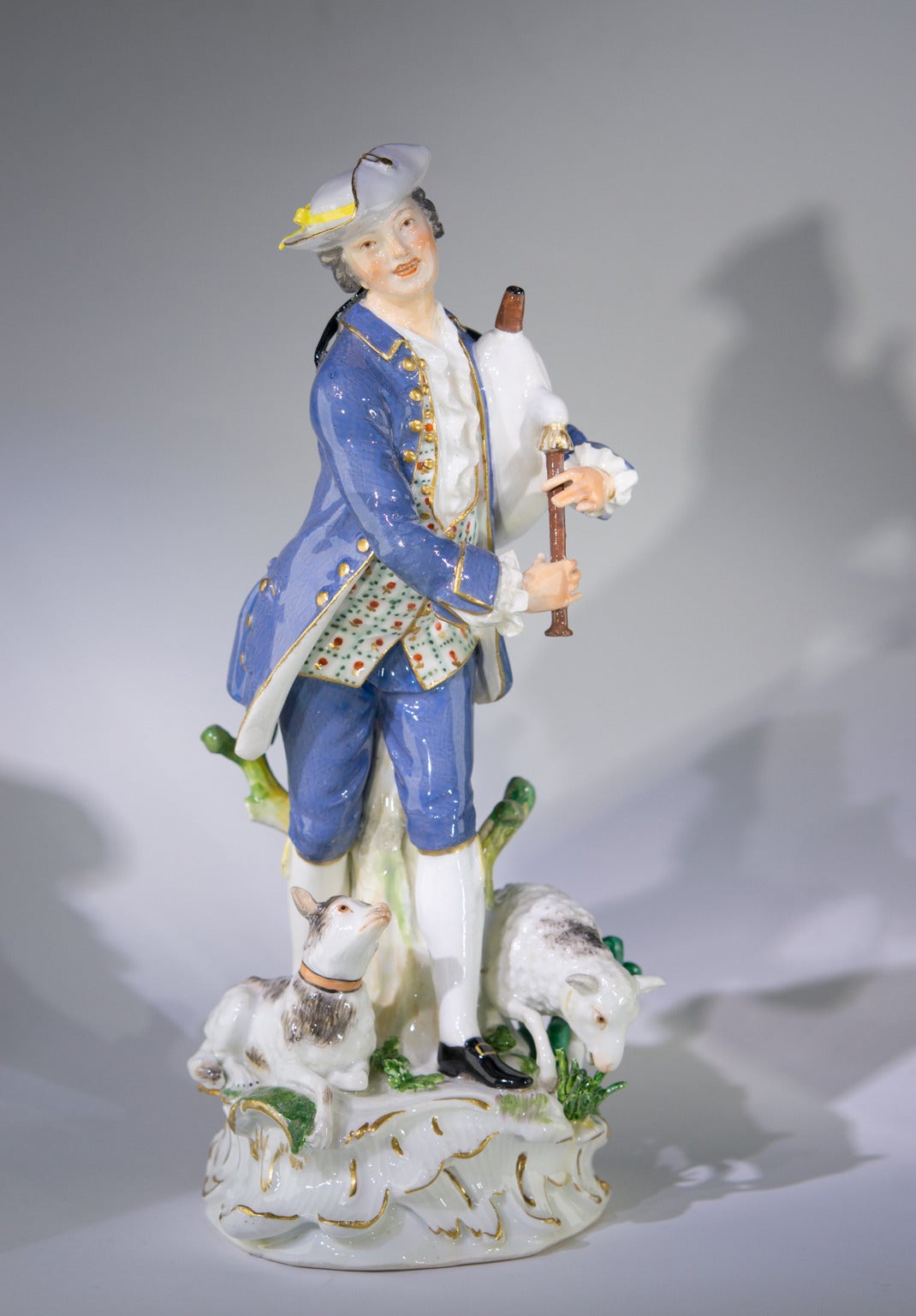 Meissen figure of a piping shepherd, dressed smartly in a blue coat & white had, a lamb and a dog at his feet. 
Crossed swords mark,  by J.J. Kandler, circa 1755.      

----------------------------
A rare, large figure. There is also a matching