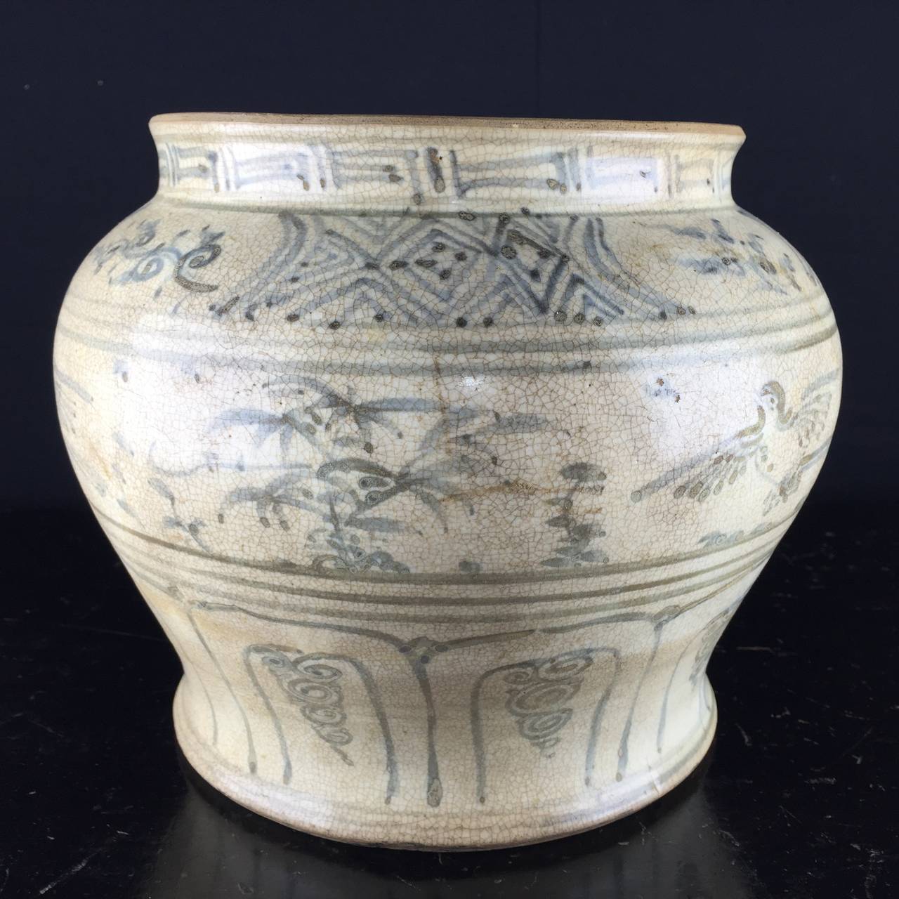 Annamese ‘Vietnamese’ jar of baluster form, painted in blue to the shoulder with panels of chi choi birds, the neck with a cell pattern ground and panels of stylized foliage beneath a ‘Greek Key’ border. 

15th century, 
similar to examples