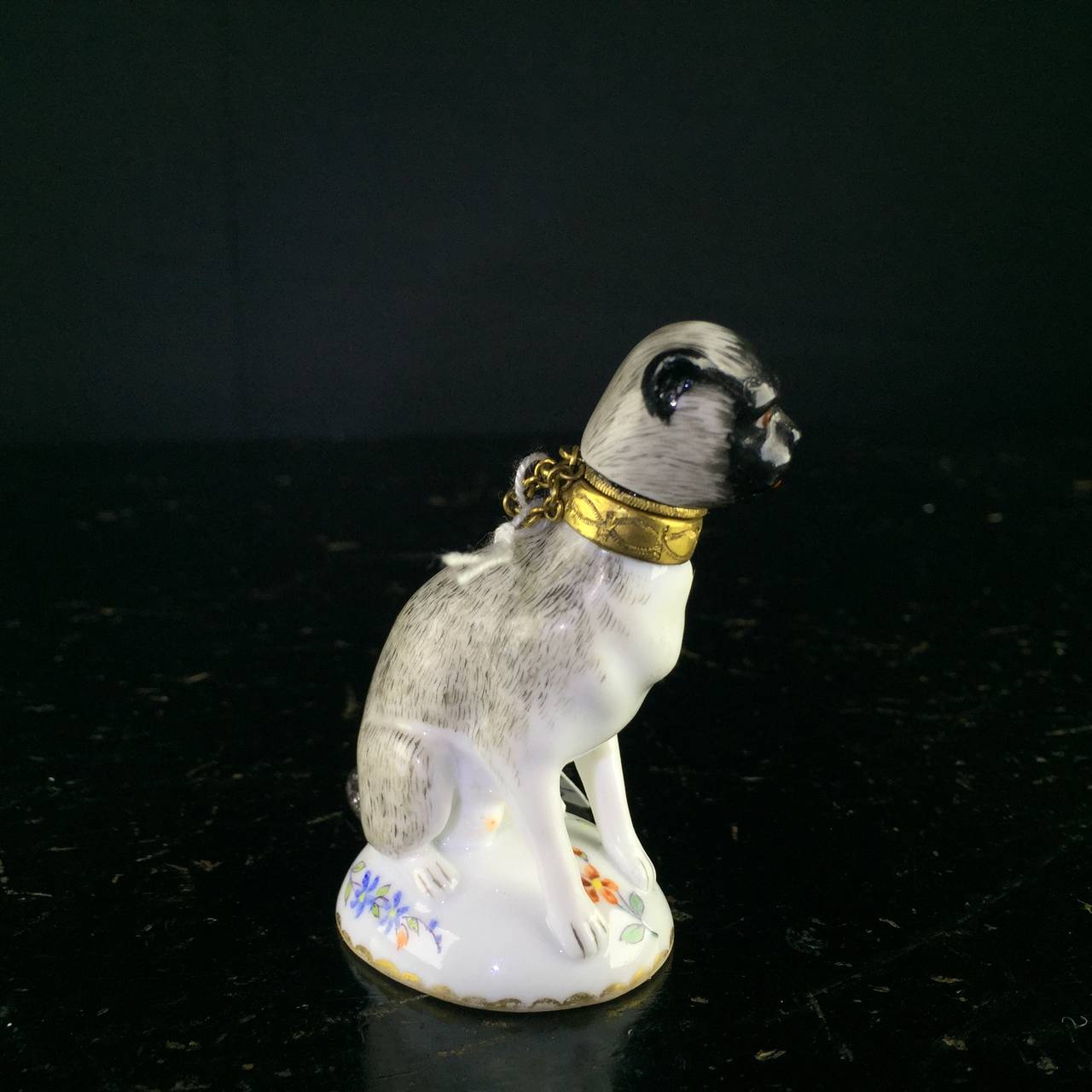 Paris porcelain perfume in the form of a pug dog, after a mid- 18th century Meissen original. 

Possibly Samson, c.1880