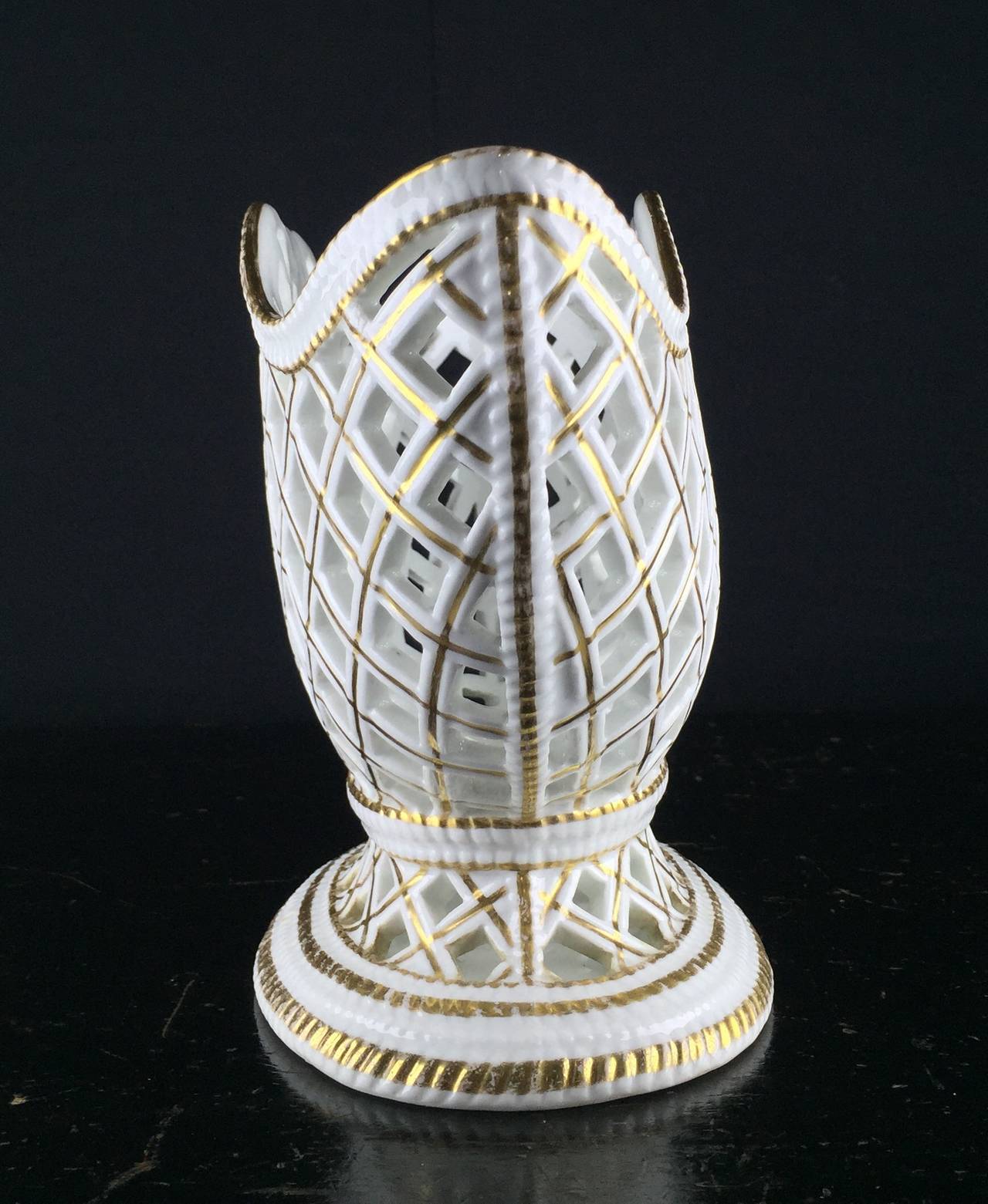 Rare pierced basket weave ‘Flaschenständer’ (wine bottle stand), the intricate openwork sides realistically representing overlapped double canes, the rims and foot simulating platted canes, the center with a shell-shaped flourish, the whole picked