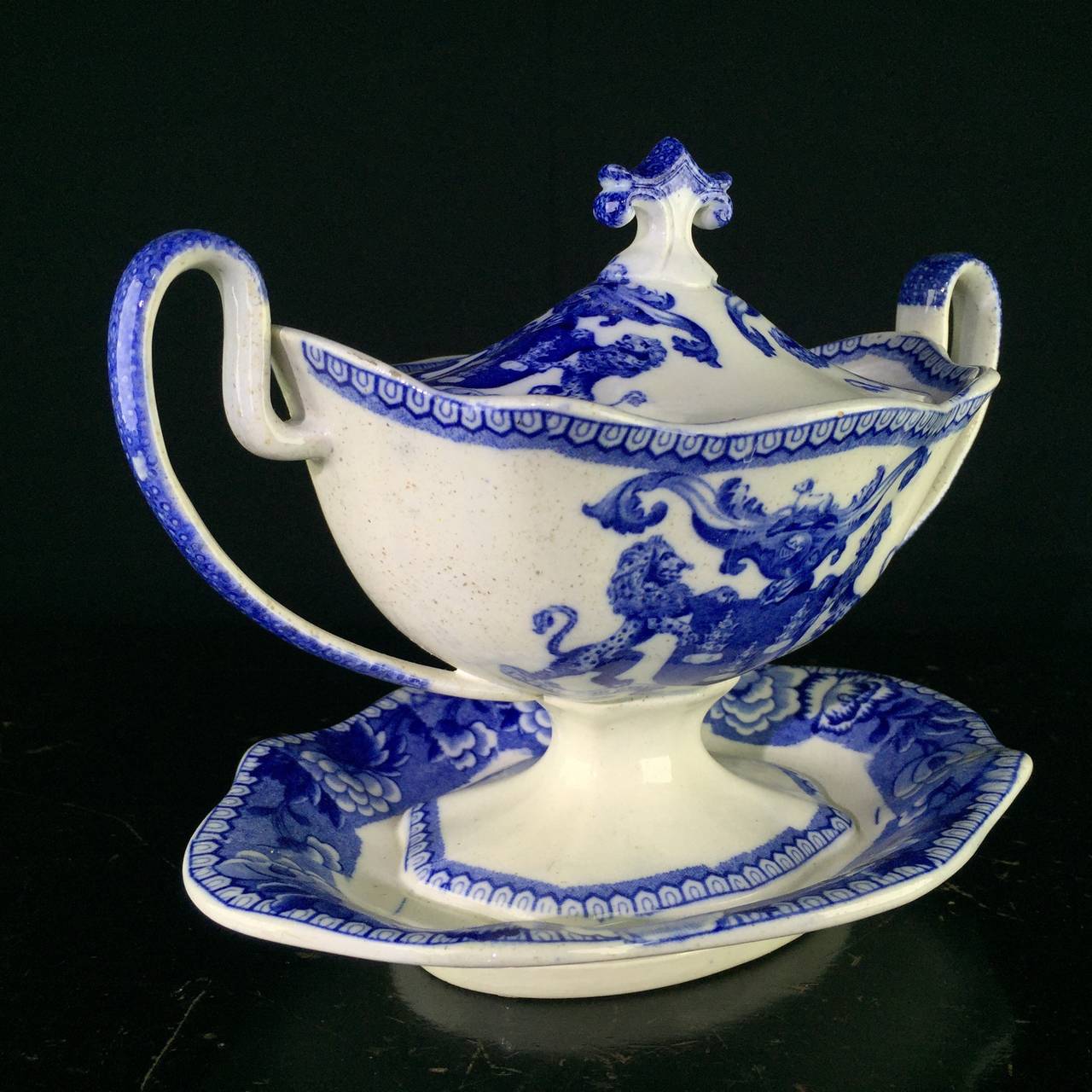 Rare Riley blue & white tureen with shapely handles and anthemion knop, from the Company of Drapers London, the center printed with a large guild arms for the Drapers titled ‘UNTO GOD ONLY BE HONOUR AND GLORY’, within a flower border.Unmarked, other