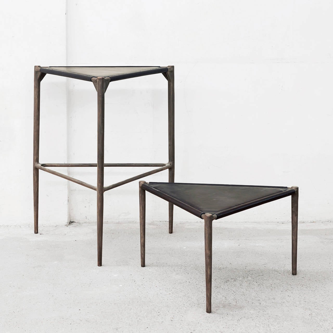 Alchemy Bar Stool by Rick Owens available from LMD/studio. 

The Rick Owens Alchemy Barstool feautres a bold three-legged design in texturally rich cast bronze. The barstool seat is wrapped in a soft stitched leather giving the stool a tactile,