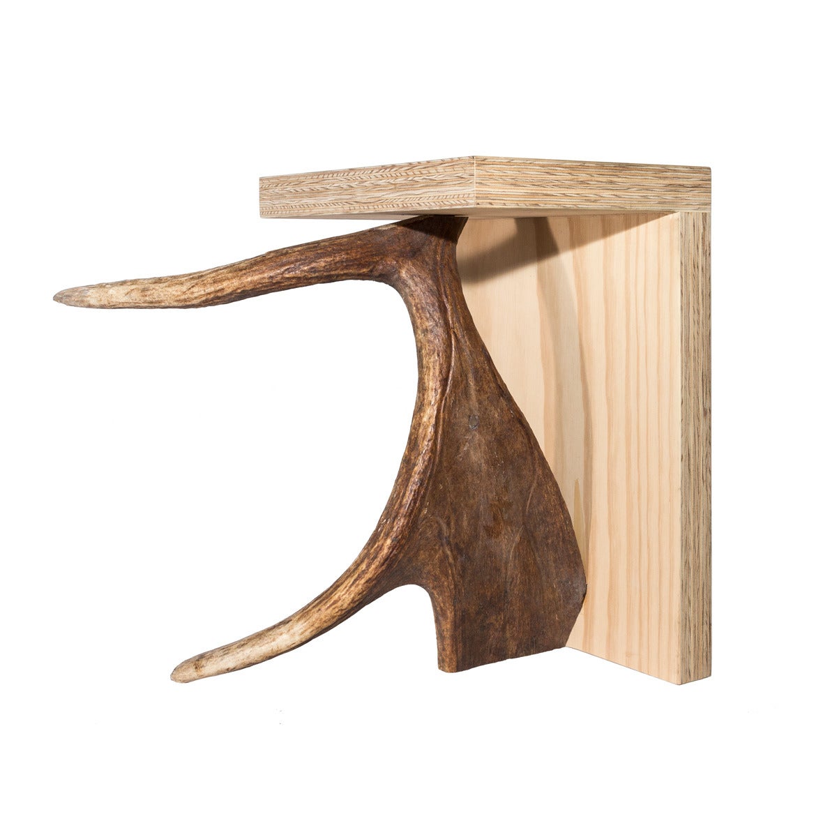 Created by world famous fashion designer Rick Owens in collaboration with his partner Michel Lamy, the stag T stool by Rick Owens Home collection is one of LMD or studio's most in demand items.

The stag T stool consists of a perpendicular