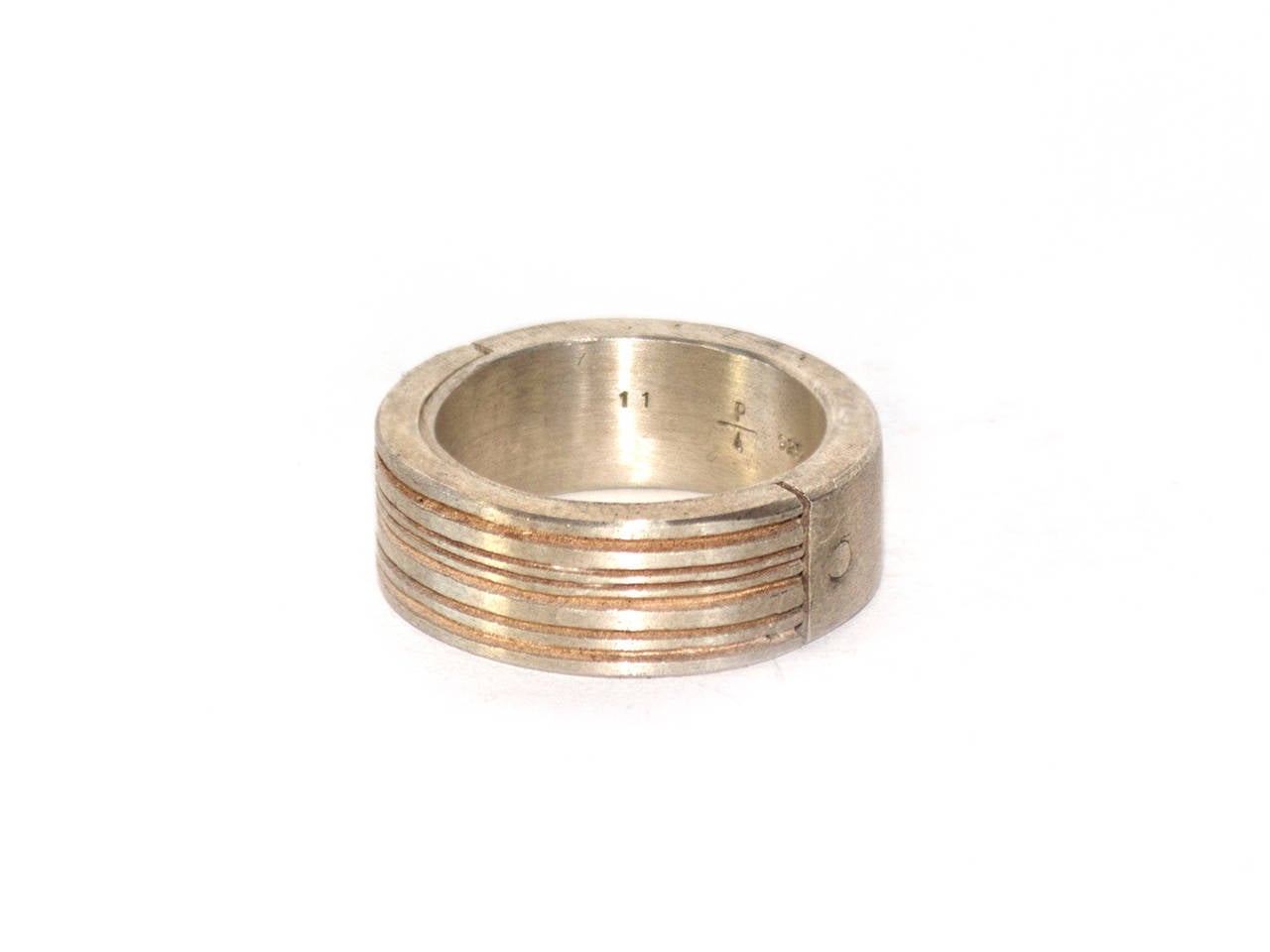 Matte sterling and matte brass ring by P/4
Size: 11