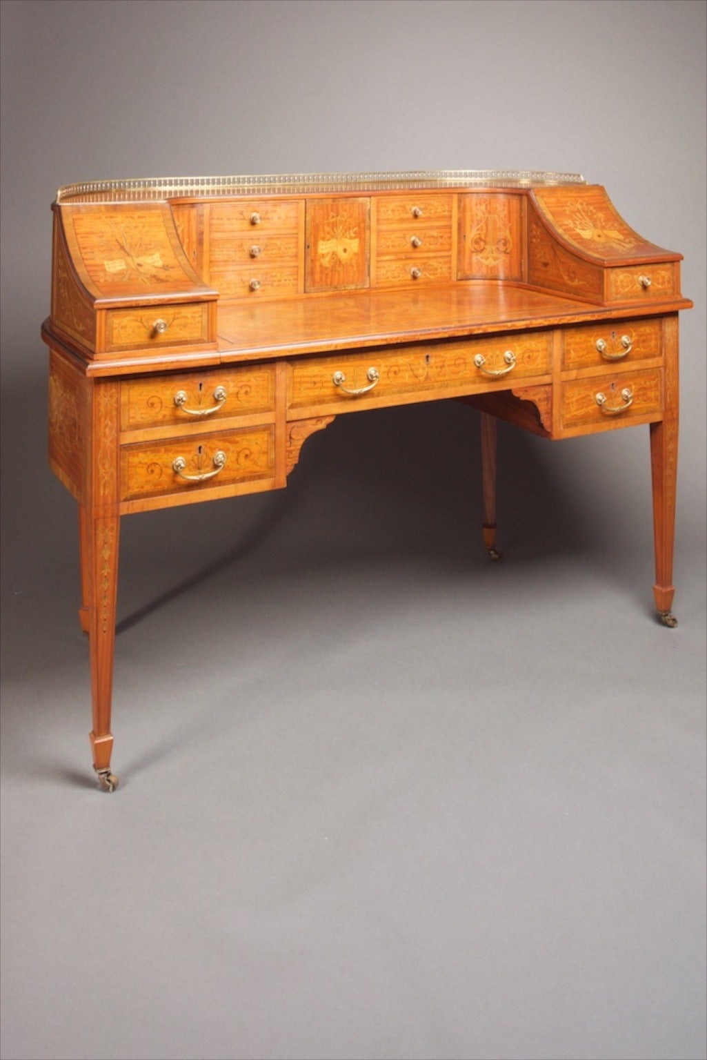 Georgian revival Carlton House desk, c 1890's. The original Carlton House desk was designed & made for the Prince Regent soon to be George IV for his London residence Carlton House. This is a high quality piece made from Ceylonese satinwood inlaid