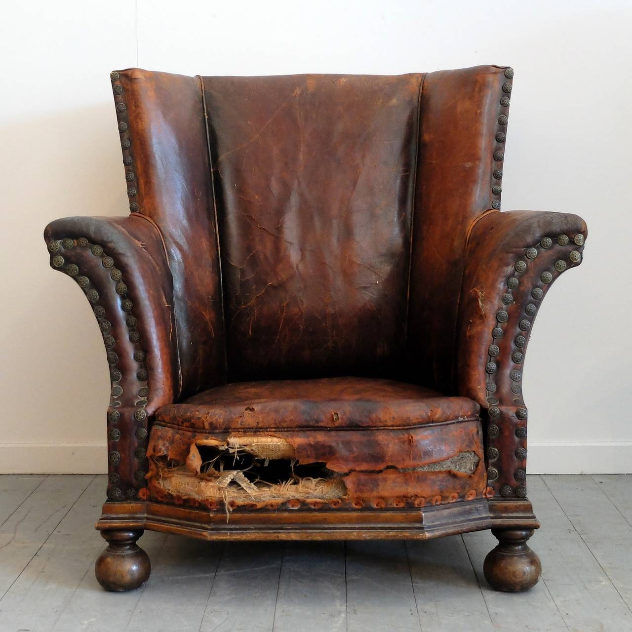 Distressed Leather Armchair In Distressed Condition For Sale In Fitzroy, Victoria