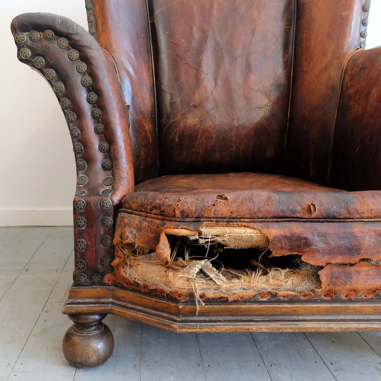 20th Century Distressed Leather Armchair For Sale