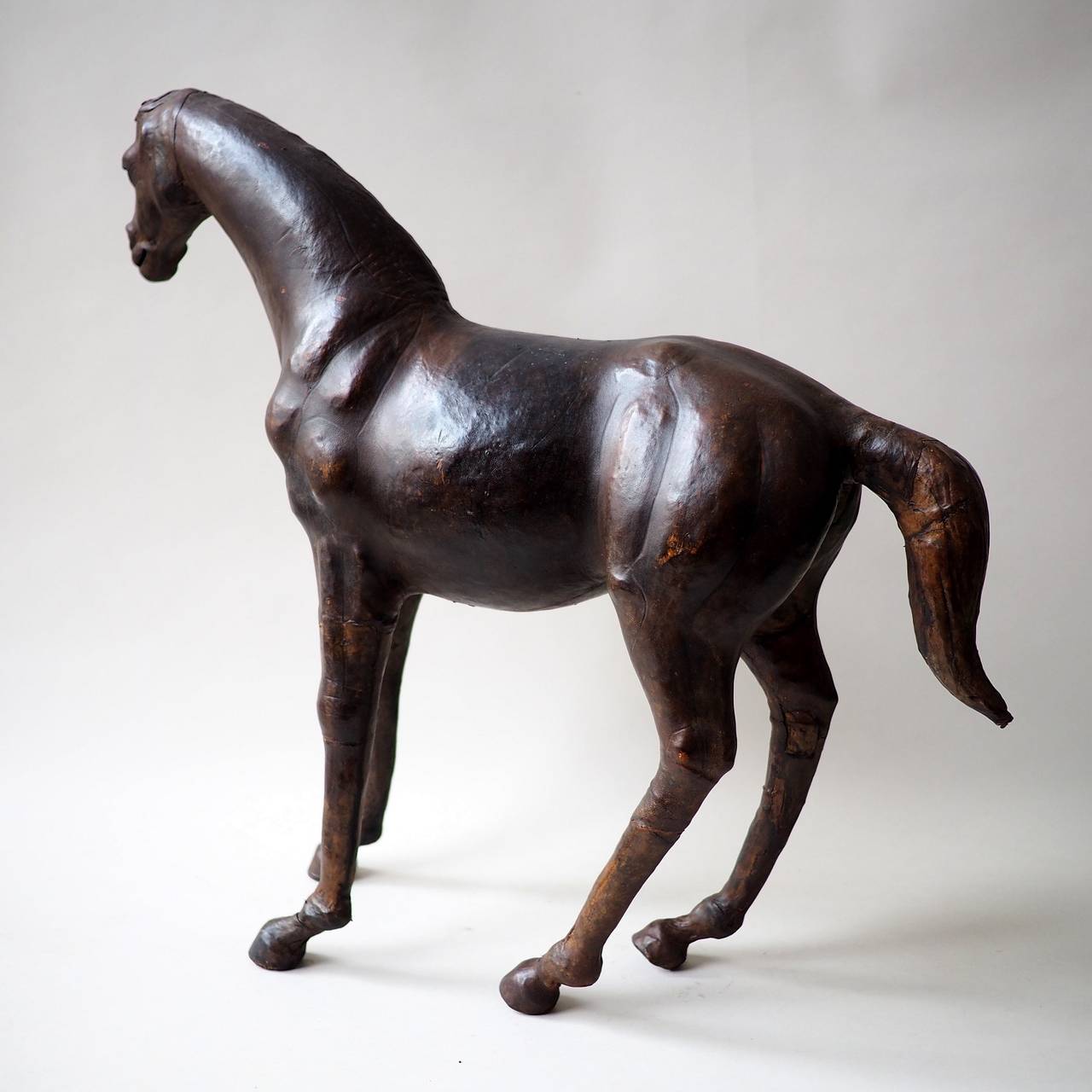 Beautiful leather covered racehorse figurine.