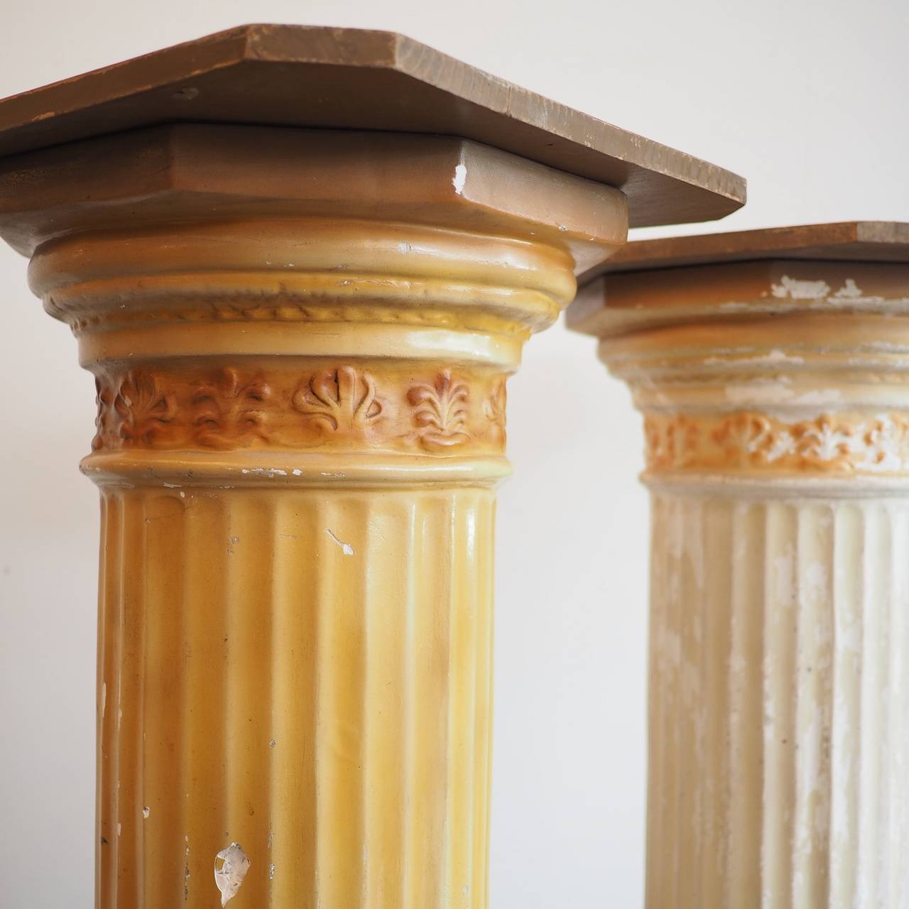 Painted Mattei Bros. plaster fluted Doric columns, with timber top and base. 

The Mattei bros. were early 20th Century Italian migrant brothers who set up in Melbourne making religious statuary. These pedestals would have been designed for the