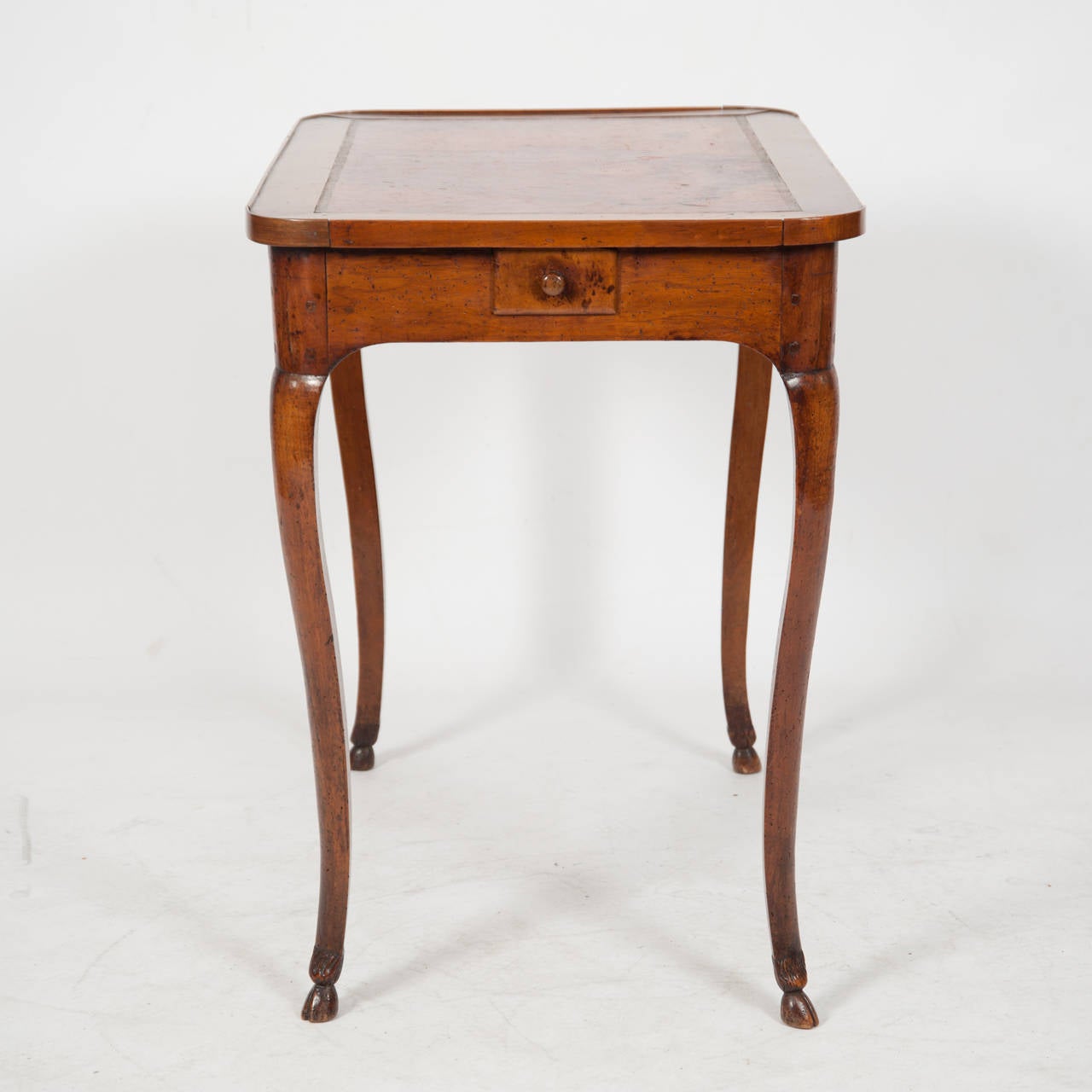 18th century French side table with leather top with radius corners single drawer above cabriole legs and hoof feet 

Height 700 
Length 765 
Depth 510