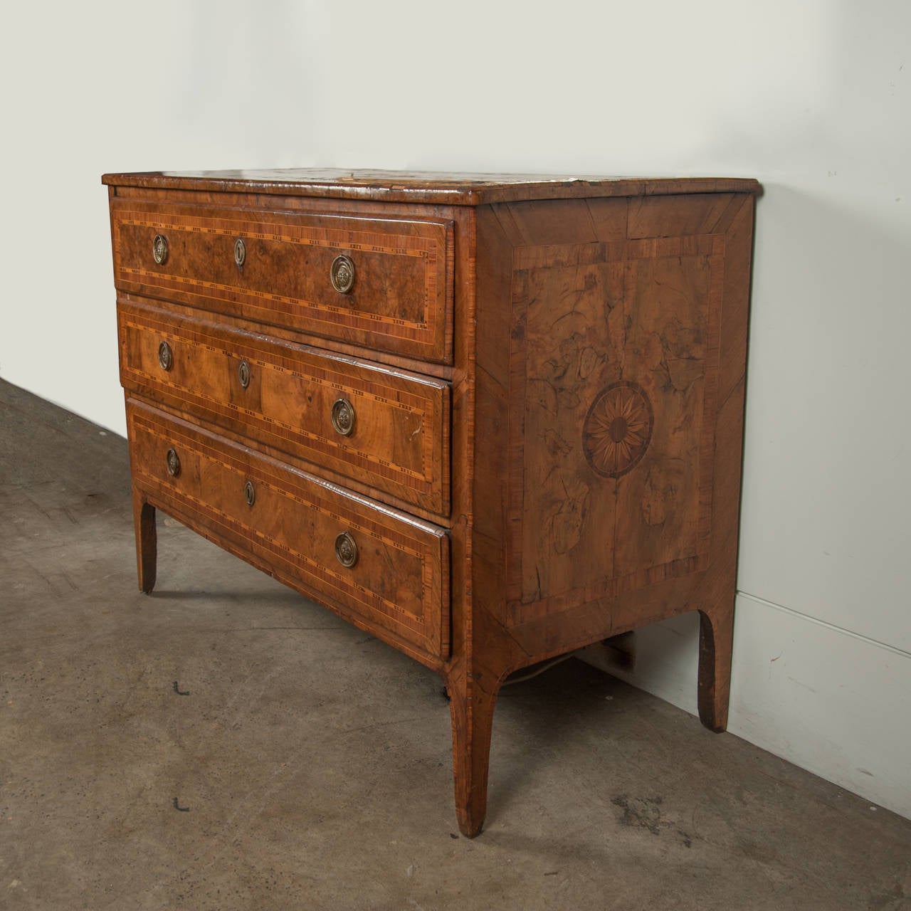 Late C18Th Italian Marquetry Commode Rectangular Top 3 Long Drawers Tapered Legs Veneered In Quarter Cut Book Matched Walnut With Exotic Timbers To The Central Boss Cross Banded Borders Top Sides And Drawers Drop Ring Brass Handles. C1780 H900 L1190