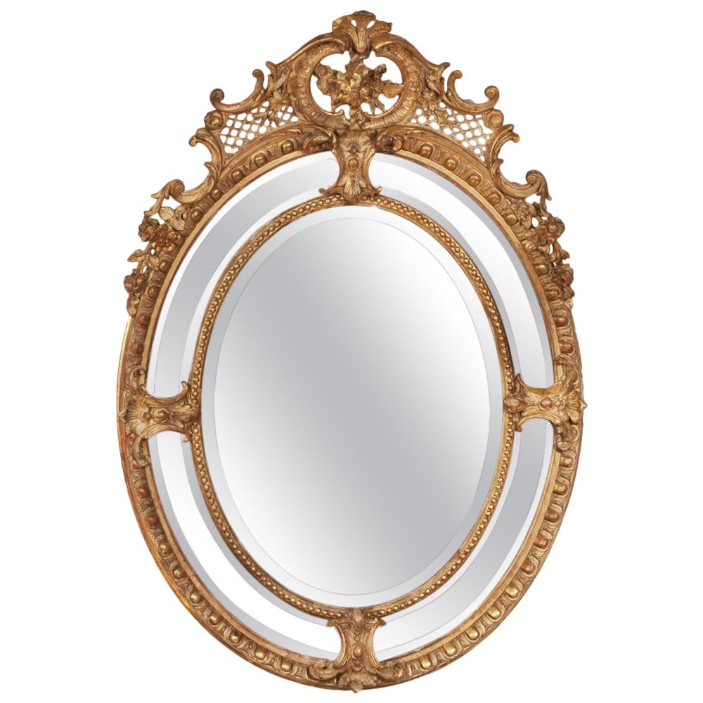 French Gilded Oval Framed Mirror, circa 1850 For Sale