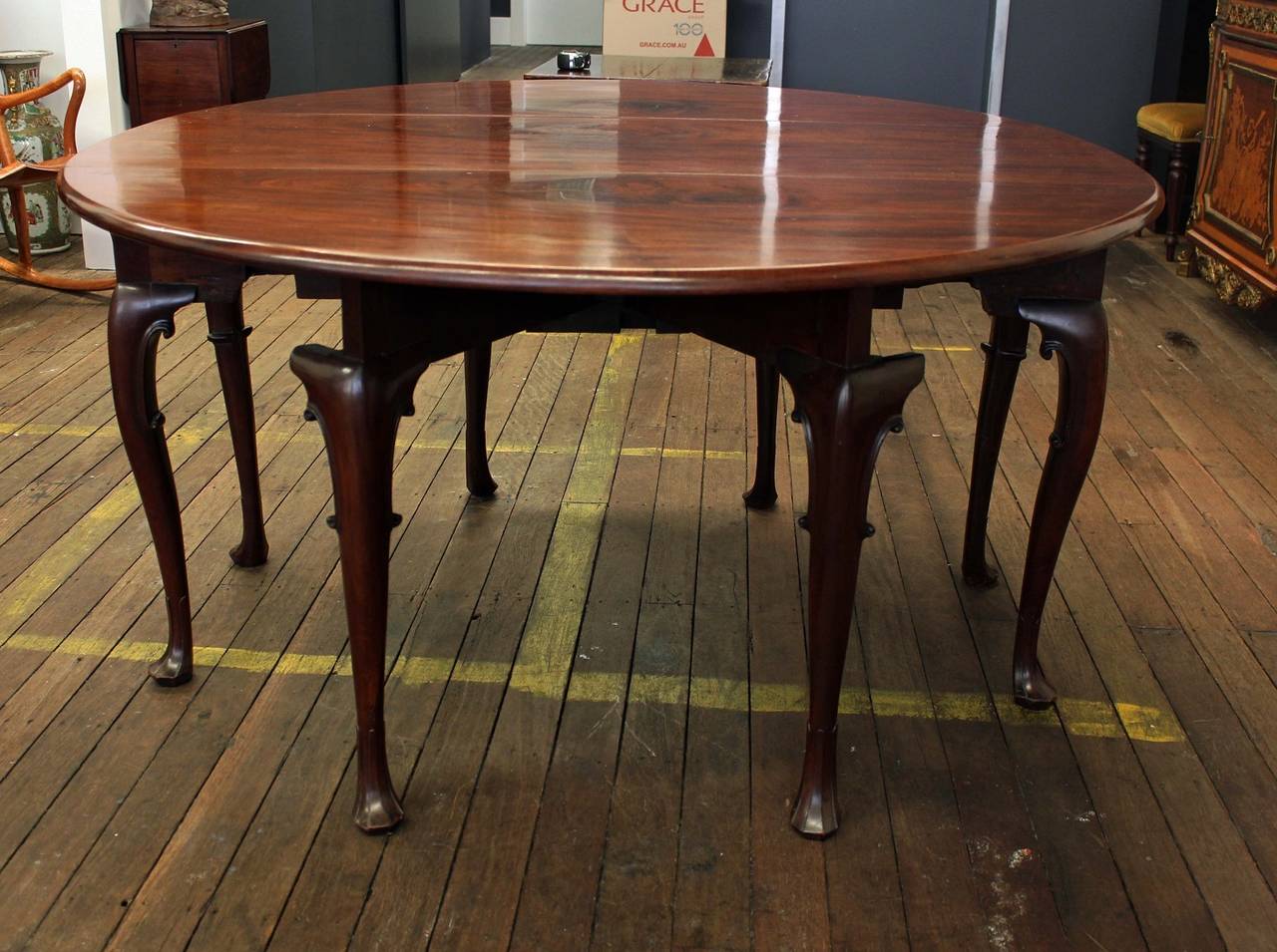 An unusual George II period mahogany gate leg table.
Raised on eight cabriole legs with carved sea scrolls on spreading carved scallop feet. The table opens to form as oval with moulded edge.
Mahogany, oak and chestnut.

Provenance:
Mallet
