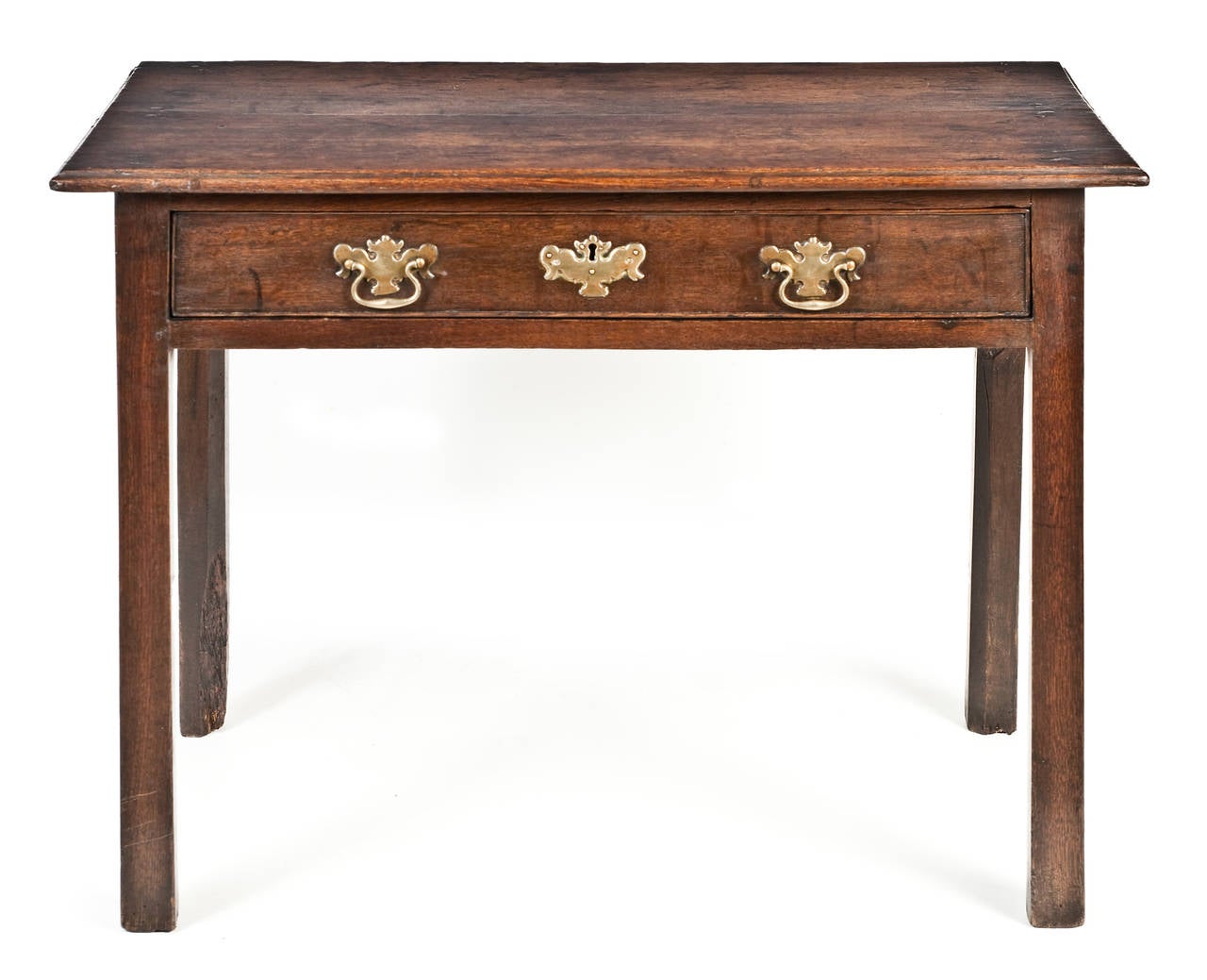 A stunning 18th Century Irish oak side table of unusual proportions, having an exceptional patina and retaining the original brasses.

The long moulded top, above a plain frieze, housing one long single drawer, having the original brass-work,
