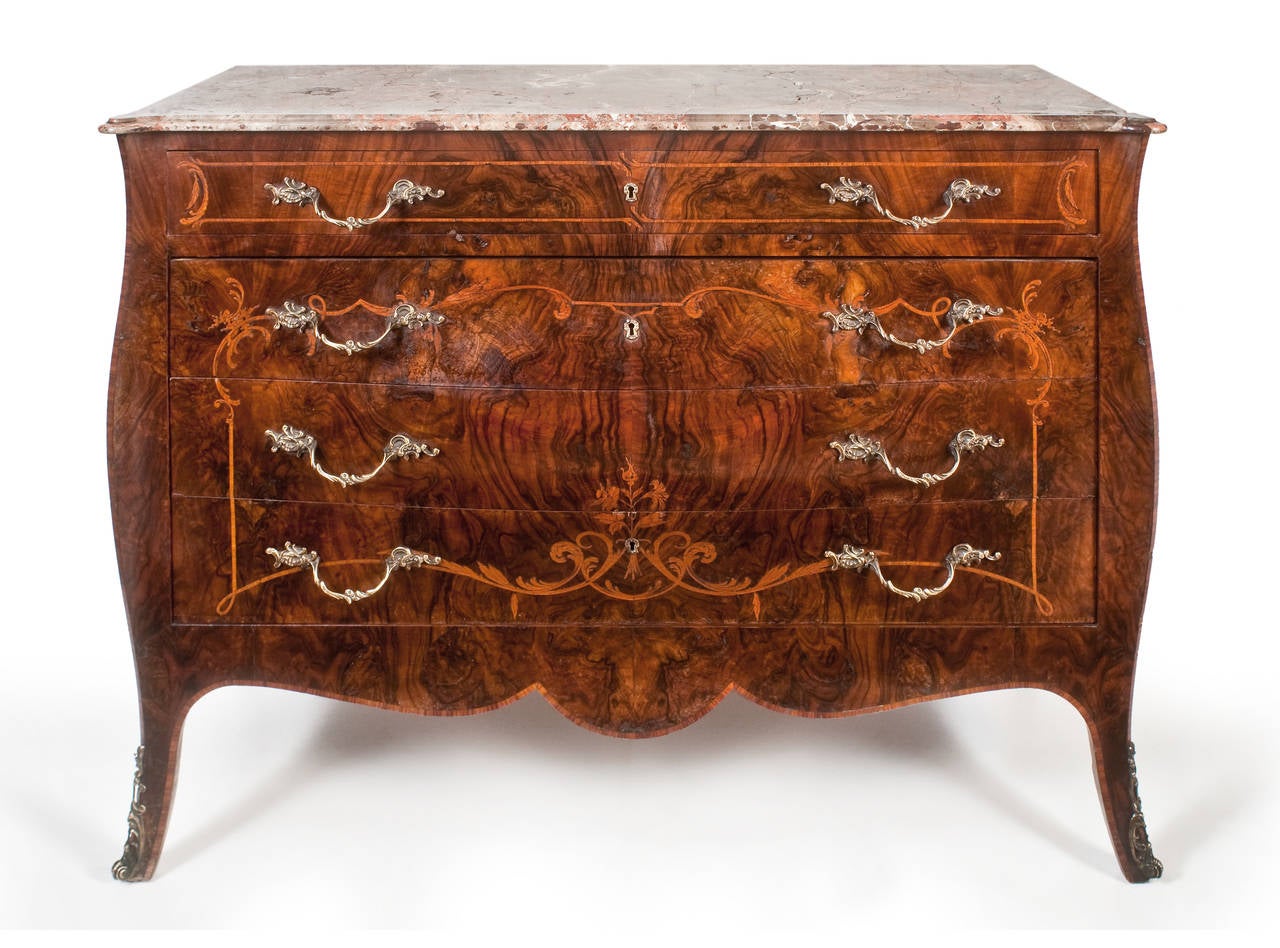 Stunning late 19th century French book-matched figured walnut and beautifully inlaid commode. Having the most beautiful original moulded marble top. above the slight bombe shaped drawer front. Having beautifully book-matched rich figured walnut