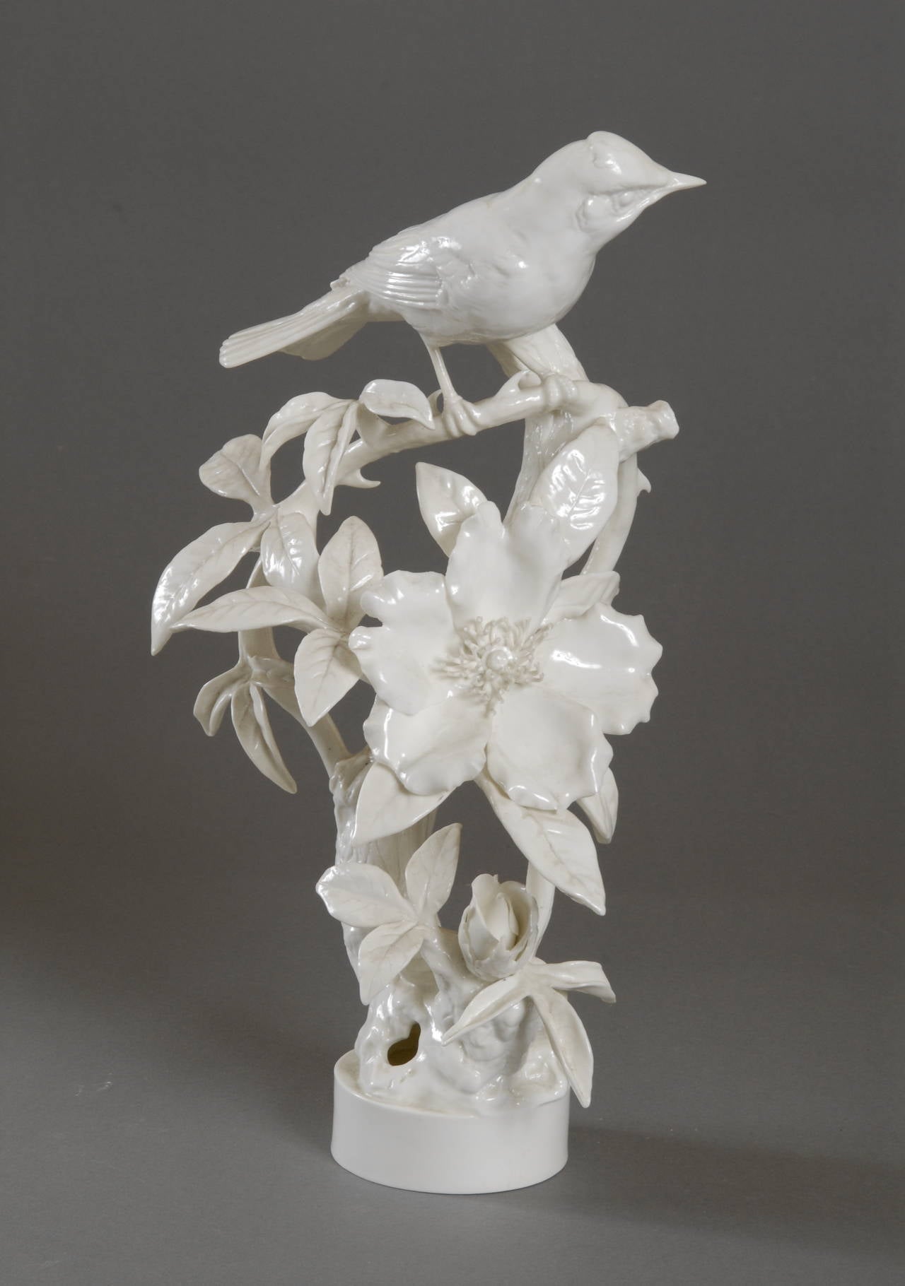 Hooded Warbler, cock and hen perched on a Cherokee Rose, modelled by Dorothy Doughty for the American Bird Series made in porcelain by Royal Worcester. Limited edition of 500 pairs which were colored, modelled in 1956, model numbers 3590 and 3591