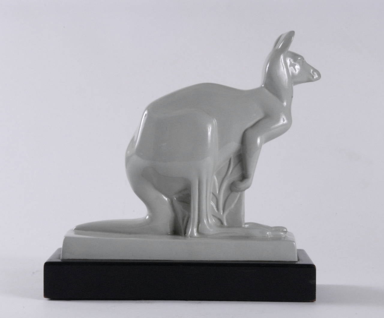 A Wedgwood kangaroo in celadon color designed by John Skeaping, circa 1930.
Mounted on its original black painted timber base and signed in the clay on the rear of the ceramic plinth, finished in a gloss celadon glaze.
Some areas with minor