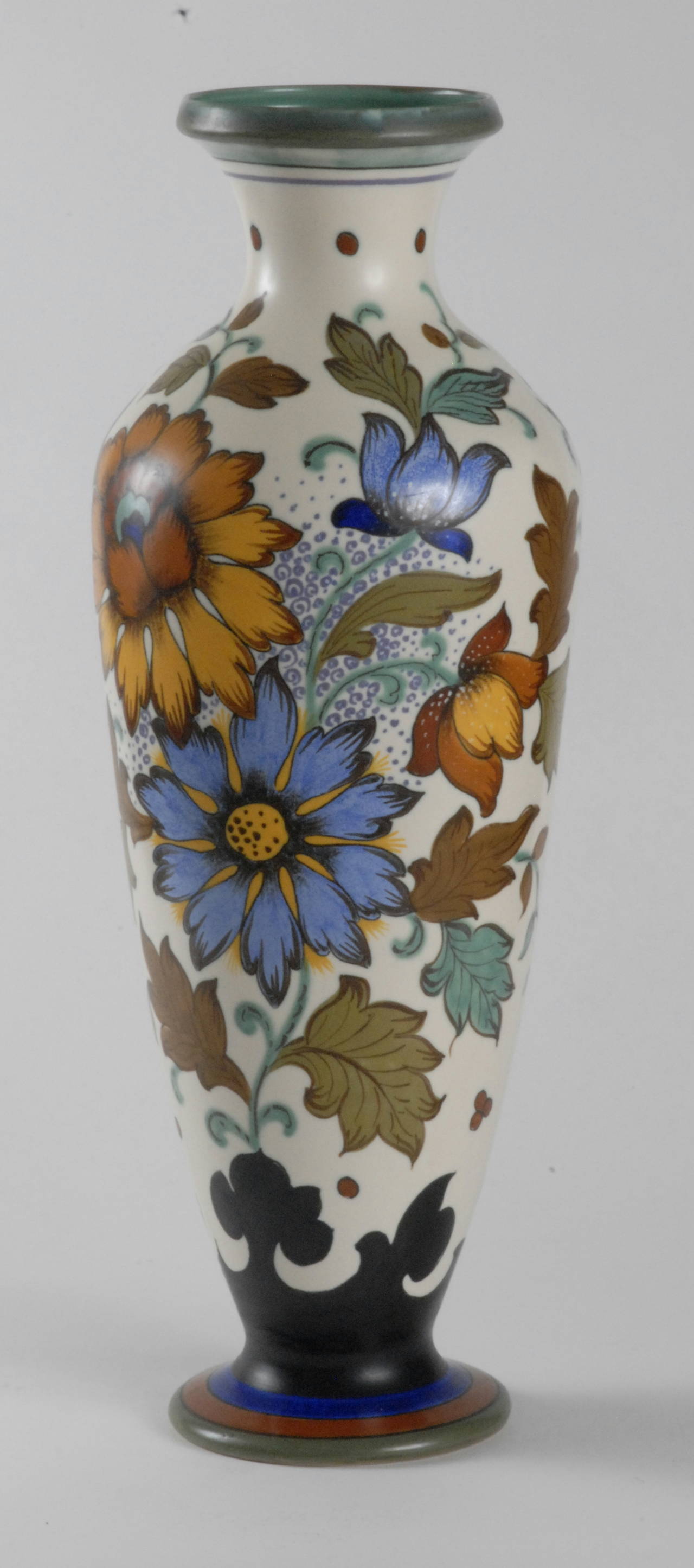 A large, 61cm, Gouda floral decorated vase, marked Plateelbakkerij Zuid-Holland[PZH].
The pattern is called 