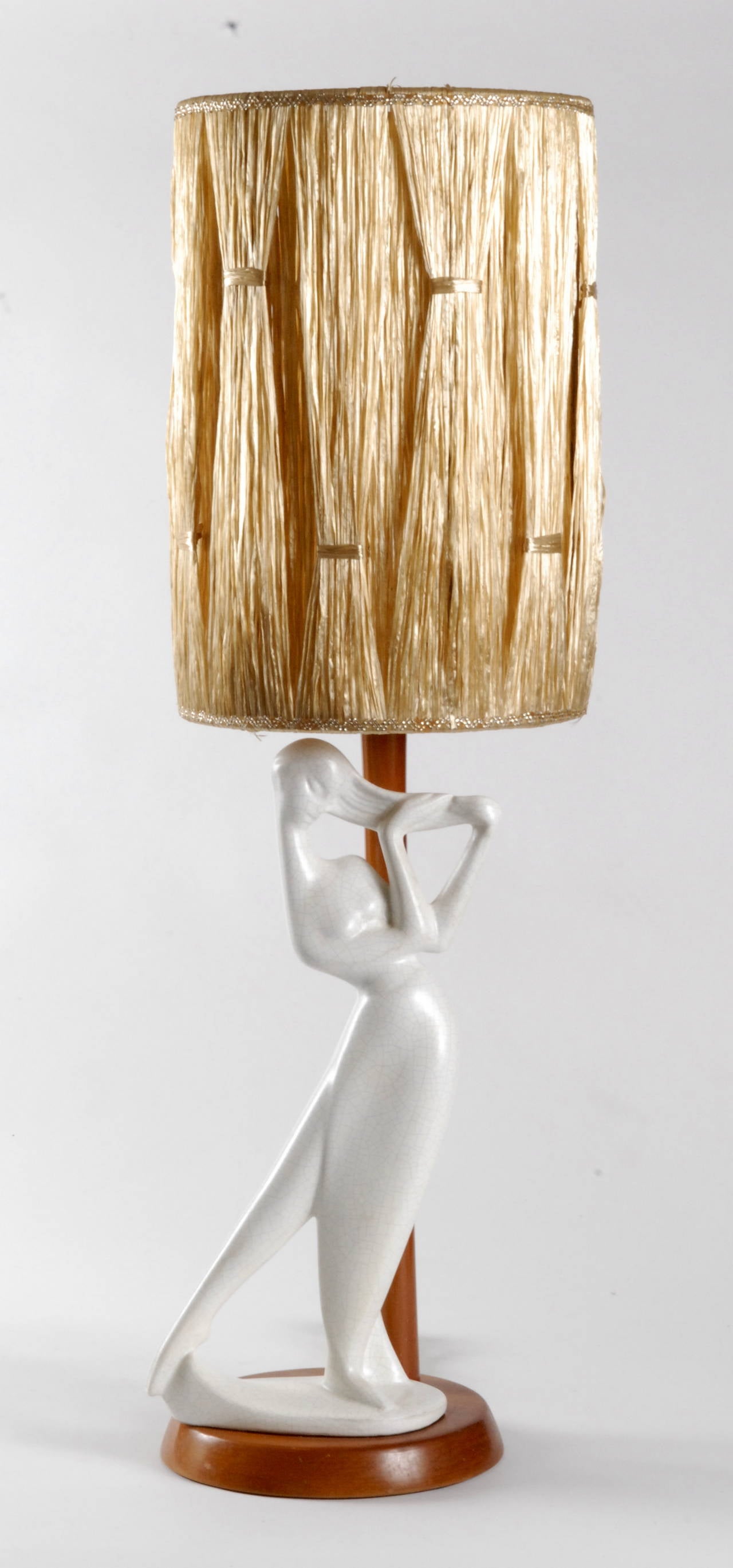 Barsony ceramics is an Australian company founded in the 1950s by Husband and Wife team George and Jean Barsony in a factory in Guildford near Sydney.
This very large white lady lamp is very rare, especially with its original raffia shade. The