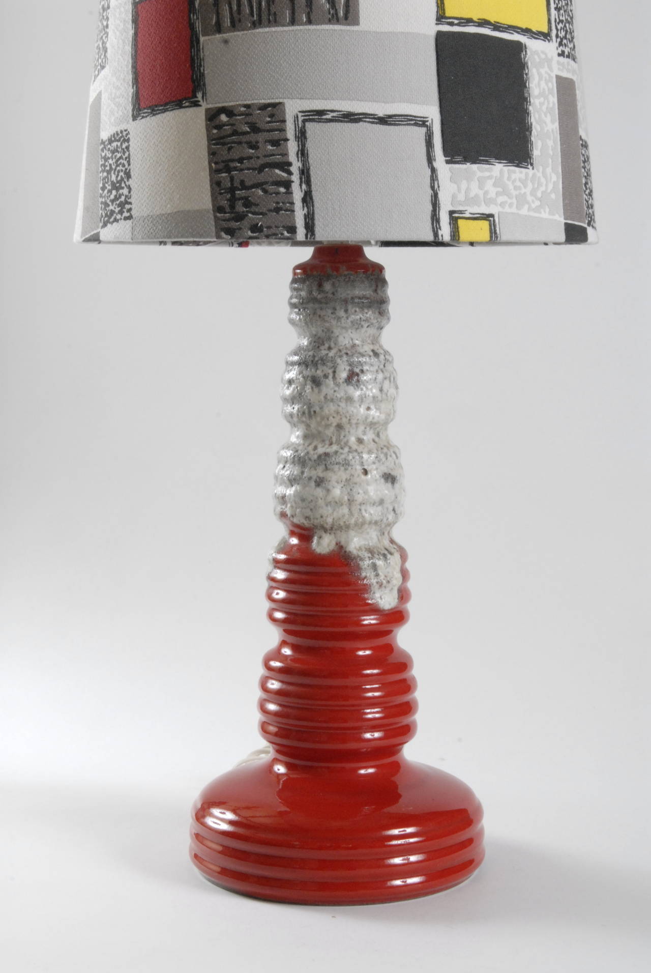 A large 1960's West German 'Fat Lava' glazed lamp base with a new shade made using original 1950's bark cloth fabric.
The base is marked as shown and the maker is probably Scheurich.
The base is 51cm high and with the shade it is 111cm in total.