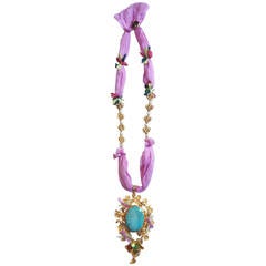 Gold and Turquoise Pendant Necklace on Pink Silk